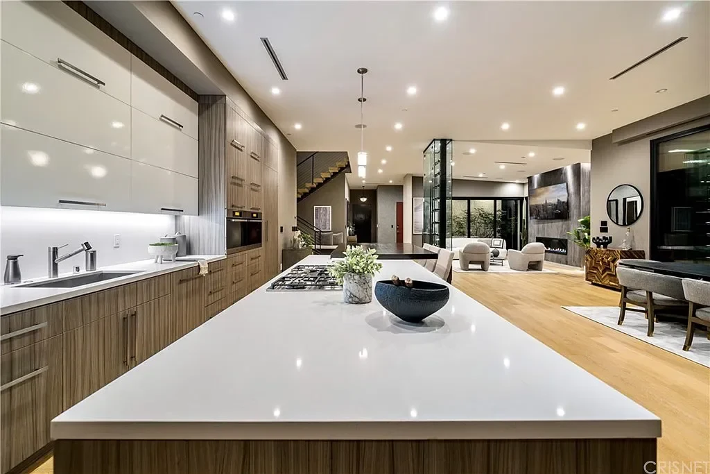Kitchen cabinetry paired with a generous island countertop. — Villa Laurel