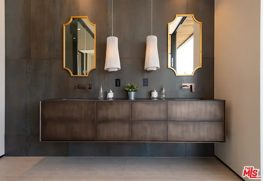 Bathroom faucets paired with a double-vanity surface. — La Dulce Vida